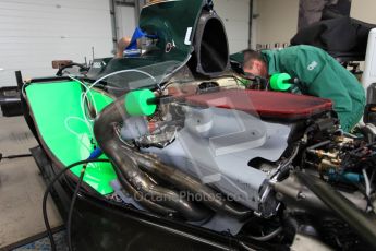 World © Octane Photographic 2010. 2010 Classic Lotus Festival, Snetterton. June 20th 2010. Lotus F1 garage - Lotus T124. Digital Ref : 0028CB5D3577