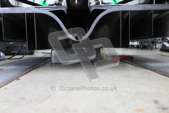 World © Octane Photographic 2010. 2010 Classic Lotus Festival, Snetterton. June 20th 2010. Lotus F1 garage - Lotus T124. Digital Ref : 0028CB5D3580