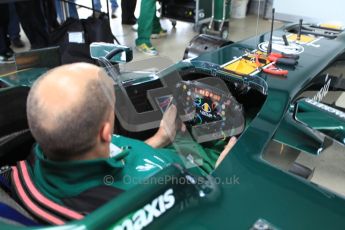 World © Octane Photographic 2010. 2010 Classic Lotus Festival, Snetterton. June 20th 2010. Lotus F1 garage - Lotus T124. Digital Ref : 0028CB5D3581