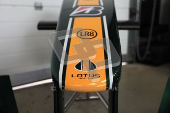 World © Octane Photographic 2010. 2010 Classic Lotus Festival, Snetterton. June 20th 2010. Lotus F1 garage - Lotus T124. Digital Ref : 0028CB5D3586