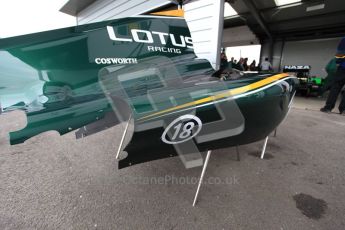 World © Octane Photographic 2010. 2010 Classic Lotus Festival, Snetterton. June 20th 2010. Lotus F1 garage - Lotus T124. Digital Ref : 0028CB5D3588