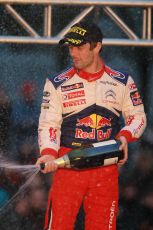 © North One Sport Limited 2010/ Octane Photographic Ltd. 2010 WRC Great Britain Podium, Sunday 14th November 2010, Loeb sprays the victory champagne. Digital ref : 0114CB1D1374