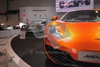 World © Octane Photographic 2010. © Octane Photographic 2011. Autosport International 2011. McLaren display. MP4/12C and F1. Digital ref : 0026CB1D5203