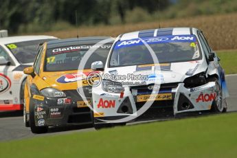 © Octane Photographic Ltd. 2011. British Touring Car Championship – Snetterton 300, a battle scarred Tom Onslow-Cole - Ford Focus - Team Aon holds off Dave Newsham in his Special Tuning Racing SEAT Leon. Sunday 7th August 2011. Digital Ref : 0124CB1D4235