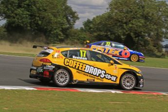 © Octane Photographic Ltd. 2011. British Touring Car Championship – Snetterton 300, Sunday 7th August 2011. Andrew Jordan - Vauxhall Vectra - Pirtek Racing over running the corner as Dave Newsham - SEAT Leon - Special Tuning Racing gains a position. Digital Ref : 0124LW7D0040