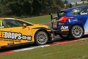 © Octane Photographic Ltd. 2011. British Touring Car Championship – Snetterton 300, Sunday 7th August 2011. Dave Newsham - SEAT Leon - Special Tuning Racing "leans" on Tom Onslow-Cole's Team Aon Ford Focus. Digital Ref : 0124LW7D0114