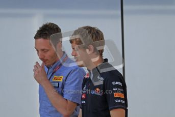 © Octane Photographic Ltd. 2011. European Formula1 GP, Saturday 25th June 2011. Formula 1 paddock. Sebastian Vettel talks to Pirelli tyre tech - Red Bull Racing Digital Ref:  0087LW7D6207