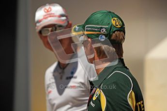 © Octane Photographic Ltd. 2011. European Formula1 GP, Sunday 26th June 2011. F1 Paddock Sunday. Michael Schumacher - Mercedes GP Petronas F1 Team chatting with Heikki Kovalainen - Team Lotus Digital Ref: 0089LW7D6419