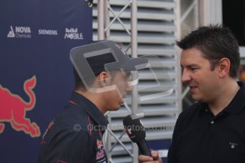 © Octane Photographic Ltd. 2011. Formula 1 World Championship – Italy – Monza – 11th September 2011. Race Day in the Paddock. Sebastien Buemi in the paddock before the race doing an interview. Digital Ref : 0193LW7D6683