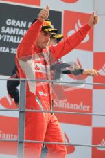 © Octane Photographic Ltd. 2011. Formula 1 World Championship – Italy – Monza – 11th September 2011 – Podium – Fernando Alonso (Ferrari) salutes teh loyal Tifossi.  Digital Ref :  0178CB1D4134