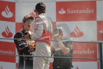 © Octane Photographic Ltd. 2011. Formula 1 World Championship – Italy – Monza – 11th September 2011 – Podium – Jenson Button (McLaren) sprays Sebastian Vettel (Red Bull) with champagne. Digital Ref : 0178CB1D4239