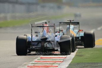 © Octane Photographic Ltd. 2011. Formula 1 World Championship – Italy – Monza – 9th September 2011, Sebastien Buemi's Torro Roso STR06 following the Team Lotus T128 of Heikki Kovalainen – Free practice 2 – Digital Ref : 0174CB7D6437