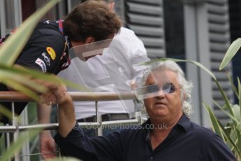 © Octane Photographic Ltd. 2011. Formula 1 World Championship – Italy – Monza – 10th September 2011, Flavio Briatore shakes hands with Christian Horner of Red Bull Racing – Free practice 3 – Digital Ref :  0175LW7D5887