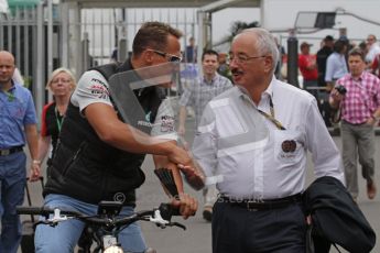 © Octane Photographic Ltd. 2011. Formula 1 World Championship – Italy – Monza – 10th September 2011, Michael Shumacher shakes the FIA steward Paul Gutjahr's hand – Free practice 3 – Digital Ref : 0175LW7D5914