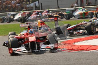 © Octane Photographic Ltd. 2011. Formula 1 World Championship – Italy – Monza – 11th September 2011 Fernando Alonso (Ferrari) and Sebastian Vettel (Red Bull) lead the pack on lap 1 – Race – Digital Ref : 0177CB7D7842