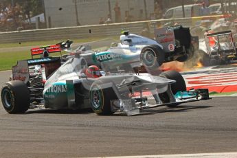 © Octane Photographic Ltd. 2011. Formula 1 World Championship – Italy – Monza – 11th September 2011 Michael Schumacher gets a mirror full of his launched Mercedes team mate Nico Rosberg after a collision with Viantonio Liutzi (HRT) – Race – Digital Ref : 0177CB7D7853