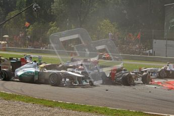 © Octane Photographic Ltd. 2011. Formula 1 World Championship – Italy – Monza – 11th September 2011 – Race – Debris showers the track after the accident caused by Viantonio Liutzi (HRT) takes out Nico rosberg (Mercedes) and Vitaly Petrov (Renault) – Digital Ref : 0177CB7D7871