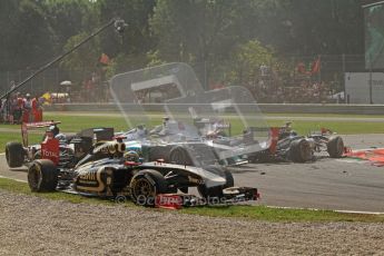© Octane Photographic Ltd. 2011. Formula 1 World Championship – Italy – Monza – 11th September 2011 Brun Senna (Renault) escapes across the grass to avoid the 1st corner accident – Race – Digital Ref : 0177CB7D7874