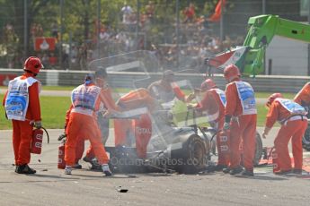 © Octane Photographic Ltd. 2011. Formula 1 World Championship – Italy – Monza – 11th September 2011 The marshalls connect Vitaly Petrov's wrecked Renault to the recovery crane – Race – Digital Ref : 0177CB7D7899