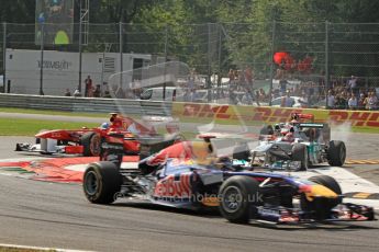 © Octane Photographic Ltd. 2011. Formula 1 World Championship – Italy – Monza – 11th September 2011 Sebastian Vettel (Red Bull) leads Fernando Alonso's Ferrari whilst Michael Schumacher (Mercedes) runs wide whilst trying to keep back Lewis Hamilton in his McLaren – Race – Digital Ref : 0177CB7D8017