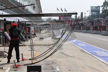 © Octane Photographic Ltd. 2011. Formula 1 World Championship – Italy – Monza – 11th September 2011 The calm before the storm: a Virgin Racing mechanic stands vigil between pitstops – Race – Digital Ref : 0177CB7D8171