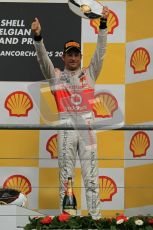 © Octane Photographic Ltd. 2011. Formula One Belgian GP – Spa – Sunday 28th August 2011 – Jenson Button hoists his trophy on the podium. Digital Reference : 0169cb1d1086