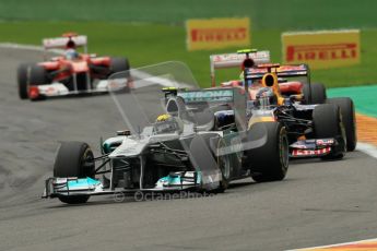 © Octane Photographic Ltd. 2011. Formula One Belgian GP – Spa – Sunday 28th August 2011 – Race. Nico Rosberg leads Sebastian Vettel and the rest of the pack at the end of lap 1. Digital Reference : 0168cb1d0425