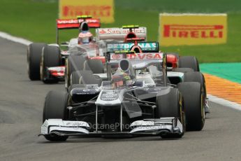 © Octane Photographic Ltd. 2011. Formula One Belgian GP – Spa – Sunday 28th August 2011 – Race. Pastor Maldonado heads Michael Schumacher into Bus Stop. Digital Reference : 0168cb1d0710