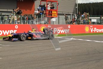 © Octane Photographic Ltd. 2011. Formula One Belgian GP – Spa – Sunday 28th August 2011 – Race. Sebastian Vettel takes the chequered flag waved by John Surtees. Digital Reference : 0168cb7d0977
