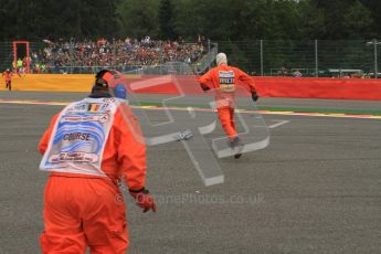 © Octane Photographic Ltd. 2011. Formula One Belgian GP – Spa – Sunday 28th August 2011 – Race. The marshalls sprint to pick up the post corner 1 debris. Digital Reference : 0168lw7d8556