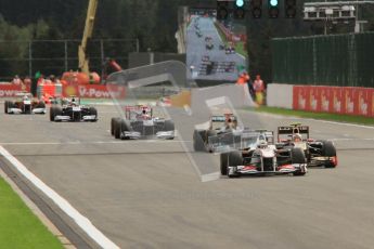 © Octane Photographic Ltd. 2011. Formula One Belgian GP – Spa – Sunday 28th August 2011 – Race. Perez and Petrov cross the line together after the restart. Digital Reference : 0168lw7d9483