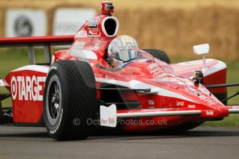 © Octane Photographic 2011. Dan Wheldon Taking a Chip Ganissi car up the hill. Goodwood Festival of Speed, Thursday 30th June 2011. Digital Ref : 0097CB7D676