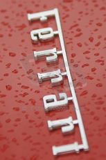 © Octane Photographic 2011 – Goodwood Revival 17th September 2011. Ferrari badge in the rain, Historic F1. Digital Ref : 0179CB1D4500