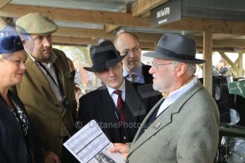 © Octane Photographic 2011 – Goodwood Revival 17th September 2011. Serious discussions in the Ford garage. Digital Ref : 0179CB1D4573