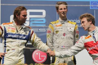 © Octane Photographic Ltd. 2011. European Formula1 GP, Saturday 25th June 2011. GP2 Race 1. Romain Grosjean, Giedo Van der Garde and Davide Valsecchi greeting the DAMS, Barwa Addax Team, and Caterham Team AirAsia congratulate each other on the podium after the race. Digital Ref: 0085CB1D8348