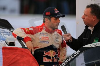 © North One Sport Ltd 2011 / Octane Photographic Ltd 2011. 13th November 2011 Wales Rally GB, Podium. Newly Crowned 8 times champions Sebastien Loeb being interviewed on the podium. Digital Ref : 0201cb1d9835