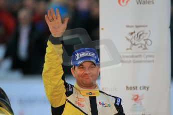© North One Sport Ltd 2011 / Octane Photographic Ltd 2011. 13th November 2011 Wales Rally GB, Podium. Henning Solberg waves to the crowd from the podium. Digital Ref : 0201cb1d9928