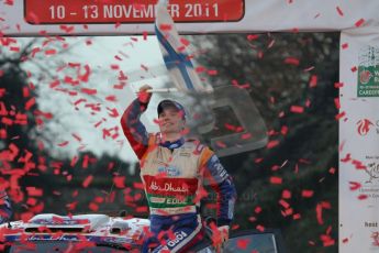 © North One Sport Ltd 2011 / Octane Photographic Ltd 2011. 13th November 2011 Wales Rally GB, Podium. Rally winner Jari-Matti Latvala salutes the crowd with a Finnish flag. Digital Ref : 0201lw7d0699