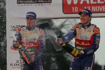 © North One Sport Ltd 2011 / Octane Photographic Ltd 2011. 13th November 2011 Wales Rally GB, Podium. Rally winners Jari-Matti Latvala and Miikka Antilla spray their victory Champagne. Digital Ref : 0201lw7d0786