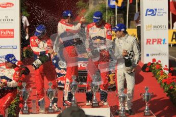 © North One Sport Ltd.2011/Octane Photographic Ltd. WRC Germany – Final Podium - Sunday 21st August 2011. Daniel Elena; Sebastien Loeb; Julian Ingrassia; Sebastien Ogier; and Daniel Sordo spraying the champaign. Digital Ref : 0153CB1D6467