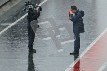 World © Octane Photographic 2011.  Formula 1 testing Saturday 12th March 2011 Circuit de Catalunya. Pitlane media interview in the wet. Digital ref : 0018CB1D4366