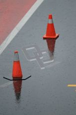 World © Octane Photographic 2011.  Formula 1 testing Saturday 12th March 2011 Circuit de Catalunya. McLaren pitlane in the wet. Digital ref : 0018CB1D4372