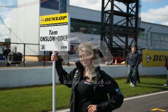 © Octane Photographic Ltd. BTCC - Round Two - Donington Park - Race 1. Sunday 15th April 2012. Tom Onslow-Cole's grid girl awaiting his arrival on the grid. Digital ref : 0295lw1d7654
