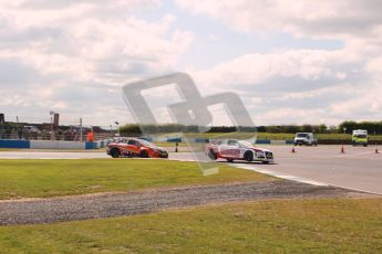 © Octane Photographic Ltd. BTCC - Round Two - Donington Park - Race 1. Sunday 15th April 2012. Rob Austin takes the Esses on 2 wheels in his Audi A4 under pressure from Frank Wrathall. Digital ref : 0295lw1d7829