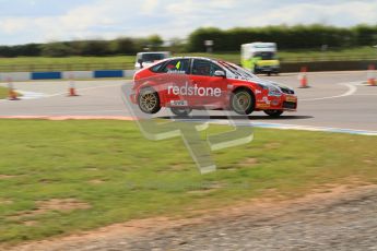 © Octane Photographic Ltd. BTCC - Round Two - Donington Park - Race 1. Sunday 15th April 2012. Mat Jackson well onto 2 wheels taking the Esses in his Redstone Racing Ford Focus. Digital ref : 0295lw7d3639
