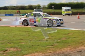 © Octane Photographic Ltd. BTCC - Round Two - Donington Park - Race 1. Sunday 15th April 2012. Tom Onslow-Cole smoking. Digital ref : 0295lw7d3881