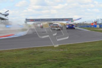 © Octane Photographic Ltd. BTCC - Round Two - Donington Park - Race 1. Sunday 15th April 2012. Tony Gilham drags gravel in his wake after battling with Adam Morgan and Jeff Smith through the Esses. Digital ref : 0295lw7d4051