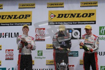 © Octane Photographic Ltd. BTCC - Round Two - Donington Park - Race 1. Sunday 15th April 2012. Mat Jackson, Matt Neal and Gordon Shedden spray the podium champagne. Digital ref : 0295lw7d4230