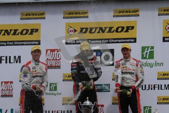 © Octane Photographic Ltd. BTCC - Round Two - Donington Park - Race 1. Sunday 15th April 2012. Mat Jackson, Matt Neal and Gordon Shedden spray the podium champagne. Digital ref : 0295lw7d4236