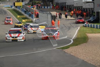 © Octane Photographic Ltd. BTCC - Round Two - Donington Park - Race 2. Sunday 15th April 2012. Gordon Shedden takes a defensive line into Redgate with Mat Jackson looking for a way past. Digital ref : 0296lw7d4571